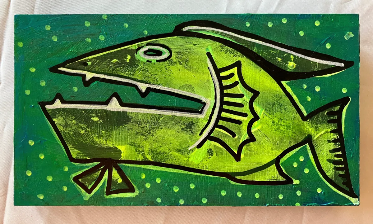 Bigmouth: a bright green fish with a long open jaw on a deep green ground flecked with yellow dots.