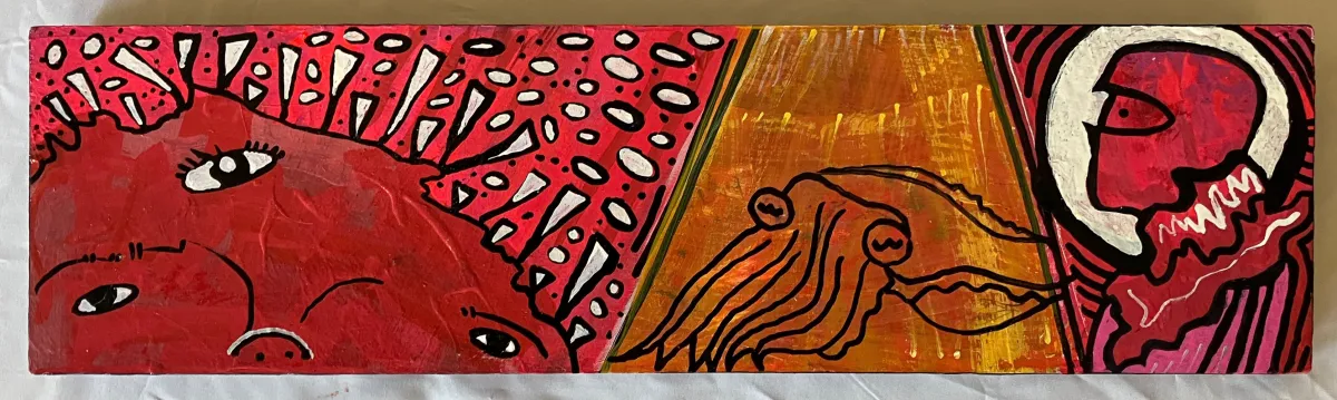 Spotlight Cuttlefish: a long horizontal red panel of patterned faces, with a pale creature surfacing at the right end.